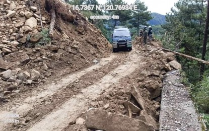 <p><strong>SAFETY FIRST</strong>. A vehicle negotiates a road in Abra after it was cleared of fallen rocks and debris from a magnitude 7 earthquake last July 27. Benguet Governor Melchor Diclas on Wednesday (Aug. 3, 2022) called on motorists to take all necessary precautions when traversing the roads in the province as landslides, rock slides, thick fog and slippery roads make their travel more perilous. <em>(PNA photo courtesy of PDRRMO)</em></p>