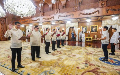 <p><strong>OATH-TAKING.</strong> President Ferdinand Marcos Jr. administers the oath of office to the new deputy and assistant presidential legal counsels in a ceremony at the Reception Hall in Malacañan Palace on Tuesday (Aug. 2, 2022). The new deputy presidential legal counsel is lawyer Joseph Sagandoy. <em>(Photo from Bongbong Marcos Facebook page)</em></p>