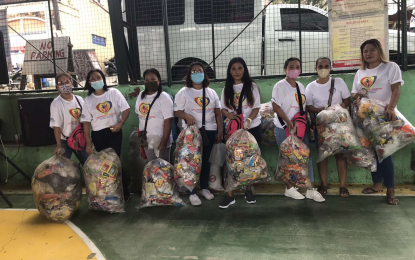 <p>Attendees of Juan Goal for Plastic in Cavite bring their used plastics to the waste collection event.<em>(Photo courtesy of URC)</em></p>