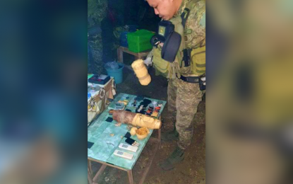 <p><strong>WAR MATERIEL.</strong> A government soldier inspects the war materiel seized from a Dawlah Islamiya terrorist who was killed during an encounter in Ampatuan, Maguindanao province on Friday (Aug. 5, 2022). Another DI member was arrested in the encounter. <em>(Photo courtesy of Westmincom)</em></p>