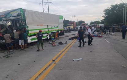 <p><strong>SAVING SURVIVORS.</strong> Rescue workers try to save survivors of the highway mishap Thursday in Barangay Batomelong, General Santos City. The number of persons killed in the three-vehicle crash rose to 10 Friday (August 5, 2022) after another victim died in the hospital.<em> (Photo from GenSan Traffic Enforcement Unit)</em></p>