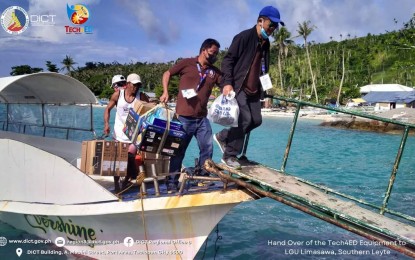 <p><strong>ONLINE SOON</strong>. A staff member of the Department of Information and Communications Technology unloads equipment in Limasawa, Southern Leyte in this July 27, 2022 photo. The package is composed of three computer units, a printer, headset, router, and closed-circuit television. <em>(DICT photo)</em></p>