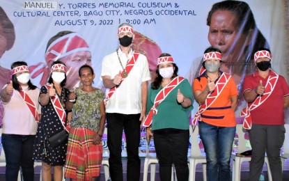 <p><strong>WORLD IPs DAY</strong>. Negros Occidental Governor Eugenio Jose Lacson (center) and Executive Assistant Marie June Pavillar-Castro (3rd from right) join the observance of the International Day of the World’s Indigenous Peoples at the Manuel Y. Torres Memorial Coliseum and Cultural Center in Bago City on Tuesday (Aug. 9, 2022). Lacson assured the IPs that his government would promote their rights and well-being, particularly their access to health care services. <em>(Photo courtesy of PIO Negros Occidental)</em></p>