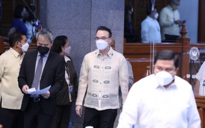 <p><strong>POSITIVE.</strong> Senator Alan Peter Cayetano (center) contracted Covid-19 on Aug. 3, 2022. Senators Imee Marcos and Cynthia Villar were next on August 8 and 9, respectively. <em>(Photo courtesy of Senate PH Facebook)</em></p>