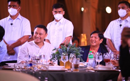 <p><strong>LGU-PRIVATE SECTOR PARTNERSHIP</strong>. Senator Sonny Angara (sitting left) and President Ferdinand Marcos, Jr. (sitting right) during the senator's birthday celebration on Aug. 6, 2022 at the Makati Polo Club. Angara said public-private partnerships (PPPs) can help at this time when government collections remain slow amid the economic recovery from the Covid-19 pandemic. <em>(Photo courtesy of Office of Senator Sonny Angara)</em> </p>