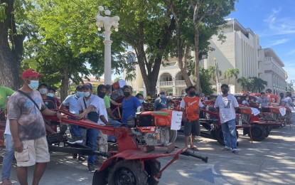 <p><strong>AID TO FARMERS</strong>. Farmer associations in Ilocos Norte receive hand tractors in this undated photo. The province continues to put a premium on its agriculture sector by boosting farmers' and fishers' productivity. <em>(File photo by Leilanie Adriano)</em></p>