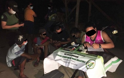 <p><strong>SEIZED ILLEGAL DRUGS.</strong> A Philippine Drug Enforcement Agency operative makes an inventory of illegal drugs seized in an operation Thursday evening (August 11, 2022) in Barangay Pangabugan, Butuan City. PDEA-13 says it confiscated some 202 grams of shabu worth PHP1.55 million in various operations in the Caraga Region early this month. <em>(Photo courtesy of PDEA-13)</em></p>