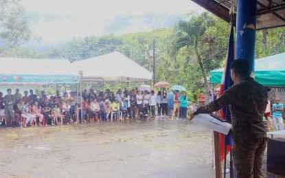 <p><strong>CONSULTATION</strong>. Lt. Col. Roderick Salayo, 11th Infantry Battalion of the Philippine Army (right), addresses residents of Barangay Talalak in Sta. Catalina, Negros Oriental province on Thursday (Aug. 11, 2022). During the activity, residents requested the rehabilitation of their primary road to improve the quality of life of the residents. <em>(PNA photo by Judy Flores Partlow) </em></p>