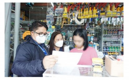 <p><strong>NON-COMPLIANT</strong>. Lilani Benedian (center), SSS Visayas West 1 Division vice president, and lawyer Eduard Dorsey Caratao  (left) of SSS Operations Legal Department explain the legal obligation of employers under Republic Act 11199 or the Social Security Act of 2018 and availment of Pandemic Relief and Restructuring Program 3 during the issuance of a notice to a delinquent establishment on Aug. 4, 2022 in Bacolod City. The SSS issued notices to 12 non-compliant employers during the Run After Contribution Evaders (RACE) campaign in the first week of August. <em>(Photo courtesy of SSS Visayas West 1 Division)</em></p>