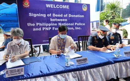 <p><strong>DEED OF DONATION</strong>. Philippine National Police chief Gen. Rodolfo Azurin (right) and PNP Foundation Inc chairman, former Senator and retired PNP chief Panfilo M. Lacson (center) together with vice chairperson Teresita Ang See sign the deed of donation at PNP national headquarters building at Camp Crame Quezon City on Monday (Aug. 15, 2022). The donation comprises office and police equipment worth PHP9.4 million that aims to bolster the PNP’s law enforcement capabilities. <em>(PNP photo)</em></p>