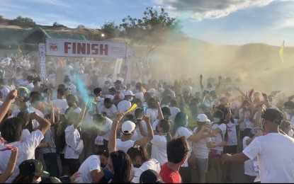 <p><strong>BANNED EVENTS</strong>. A color fun run is held in Laoag City in this undated photo. Events like this will no longer be allowed if it passes through the main road during rush hour, in compliance with an executive order issued on Wednesday (Aug. 17, 2022). <em>(File photo by Leilanie Adriano)</em></p>