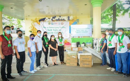 <p><strong>SAFE OPENING OF CLASSES</strong>. Education, local government and health officials led by DOH-Calabarzon Assistant Regional Director Leda Hernandez are shown during the turnover ceremony of Balik Eskwela Healthy Kit, anti-dengue and other vector control supplies at San Ramon Elementary School in Calamba City, Laguna on Tuesday (Aug. 16, 2022). The event was part of efforts to ensure the safety and welfare of students for the opening of classes on Aug. 22 <em>(Photo courtesy of DOH-Calabarzon)</em></p>