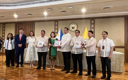 <p><strong>2023 BUDGET</strong>. Budget Secretary Amenah Pangadaman (center) submits to Speaker Martin Romualdez (4th from right) the proposed P5.268-trillion national budget for 2023 on Monday (Aug. 22, 2022). Looking on are Majority Leader Manuel Jose Dalipe (3rd right), Minority Leader Marcelino Libanan (4th left), House Committee on Appropriations chairperson and Ako Bicol party-list Representative Zaldy Co (2nd right) and his senior vice chairperson, Marikina City Rep. Stella Quimbo (3rd left), Deputy Speaker Ralph Recto (2nd left), DBM Undersecretary Joselito Basilo (right). <em>(Photo courtesy of Speaker Romualdez' office)</em></p>