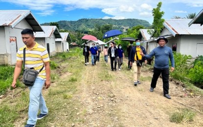 <p><strong>RURAL PROJECT.</strong> Department of Human Settlements and Urban Development-Region 2 officials inspect the completed marker and artesian well in a housing project for Indigenous Peoples in Barangay Gaggabutan West, Rizal, Cagayan on June 1, 2022. A total of 84 families are living in the housing site funded by the National Housing Authority. <em>(Photo courtesy of DHSUD-2)</em></p>