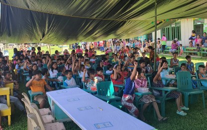 <p><strong>BRIGHTER FUTURE</strong>. Beneficiaries of book donation drive of the Philippine Army in Siljagon village, Mapanas, Northern Samar in this Aug. 20, 2022 photo. The village is previously-influenced by the New People's Army. <em>(Photo courtesy of Philippine Army)</em></p>