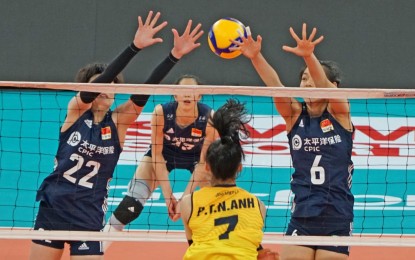 <p><strong>UNDEFEATED.</strong> Three Chinese defenders block Vietnam's Pham Thi Nguyet Anh during their match at the PhilSports Arena in Pasig City on Monday (Aug. 22, 2022). China won, 3-2, to remain undefeated in two games. <em>(Photo courtesy of Asian Volleyball Confederation)</em></p>
<p><em> </em></p>