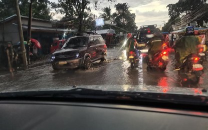 <p><strong>FLOOD WOES</strong>. A flooded street in Dumaguete City. The Negros Oriental Chamber of Commerce and Industry is pushing for a drainage/flood control master plan to address the perennial flooding problem in the capital, its president Edward Du said Tuesday (Aug. 23, 2022).<em> (PNA file photo by Judy Flores Partlow)</em></p>