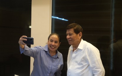 <p><strong>SPECIAL VISIT.</strong> Former president Rodrigo Duterte and Press Secretary Trixie Cruz-Angeles take a photo during the latter’s visit to Davao City on Friday (Aug. 26, 2022). In a Facebook post on Sunday, Cruz-Angeles said Duterte is enjoying his retirement and reads books. <em>(Photo courtesy of Press Secretary Trixie Cruz-Angeles Facebook)</em></p>