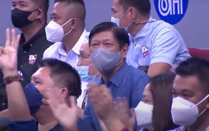 <p><strong>NO. 1 FAN.</strong> President Ferdinand “Bongbong” Marcos Jr. joins nearly 20,000 fans who watched the FIBA World Cup Qualifiers’ fourth window game between the Philippines and Saudi Arabia at the MOA Arena in Pasay City on Monday night (Aug. 29, 2022). The Gilas Pilipinas bounced back from a sluggish start to beat Saudi, 84-46.<em> (Screengrab from OnePH sports)</em></p>