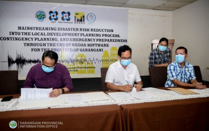 <p><strong>DISASTER PREPAREDNESS.</strong> Officials of the Philippine Institute of Volcanology and Seismology and the Sarangani provincial government inked a memorandum of agreement on Aug. 26, 2022 in General Santos City for the use of software that will help significantly improve disaster preparedness. The Rapid Earthquake Damage Assessment System (REDAS) software can simulate earthquake hazards, and compute and assess earthquake and other hydrometeorological impacts. <em>(Photo courtesy of Sarangani Information Office)</em></p>
