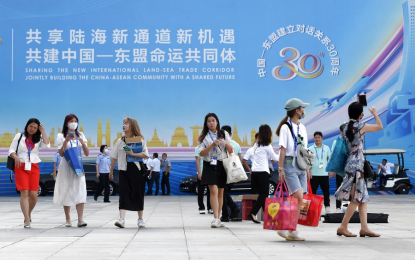 <p>People walk out of the venue of the 18th China-Asean Expo in Nanning, capital of south China's Guangxi Zhuang Autonomous Region on Sept. 11, 2021. <em>(Xinhua/Lu Boan)</em></p>