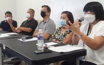 <p><strong>TANNERY INDUSTRY.</strong> Department of Trade and Industry (DTI) Bulacan Provincial Director Edna Dizon (right) explains some of the measures to revitalize the dying tannery industry in Meycauayan City during a meeting on Thursday (Aug. 31, 2022). Also in the photo are tannery owners in the locality. <em>(Photo courtesy of DTI Bulacan)</em></p>