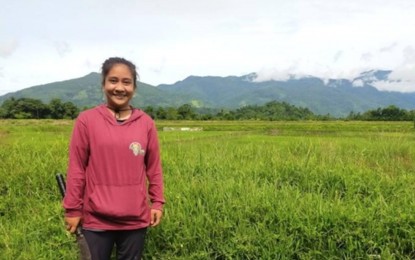 <p><strong>FULFILLING DREAM</strong>. Jie Anne Villacrusis beams with pride showing her farmland awarded to her by the Department of Agrarian Reform. With her knowledge as an agriculture graduate, she vows to help, not only her family, but other farmers as well. <em> (Photo courtesy of DAR)</em></p>