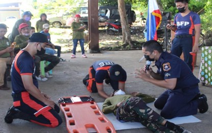 <p><strong>PEACEKEEPING TEAM.</strong> Bureau of Fire Protection personnel train members of the Barangay Peacekeeping Action Team (BPAT) on first aid techniques during the Sept. 1-2, 2022 training in Indanan, Sulu. The BPAT members will assist the Army’s 100th Infantry Battalion in the fight against the Abu Sayyaf Group and maintenance of law and order. <em>(Photo courtesy of 100IB)</em></p>