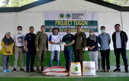 <p><strong>FINANCIAL AID.</strong> The Bangsamoro Autonomous Region in Muslim Mindanao Task Force on Ending Local Armed Conflict extends financial assistance to 53 former Abu Sayyaf Group fighters in Jolo, Sulu on Thursday (Sept. 1, 2022). The ASG surrenderers will also undergo livelihood training that would transform them into productive citizens after years of armed struggle. <em>(Photo courtesy of 11th Infantry Division)</em></p>