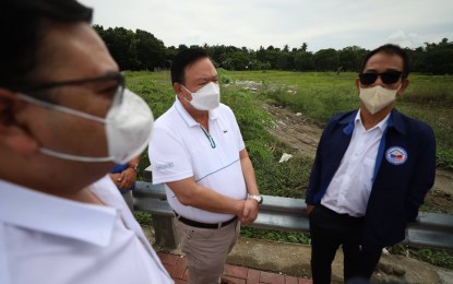 <p><strong>HOUSING PROGRAM</strong>. Department of Human Settlements and Urban Development Secretary Jose Acuzar (right) and Iloilo City Mayor Jerry P. Treñas (center) visit the city’s relocation site in San Isidro, Jaro on Sept. 3, 2022. Iloilo City is one of the areas identified for the priority housing program of the department to address the housing gap in the country. <em>(Photo courtesy of Arnold Almacen/City Mayor’s Office)</em></p>