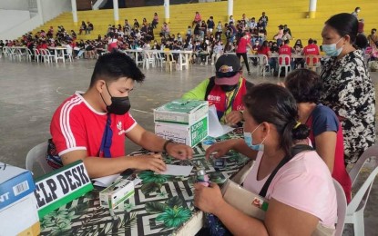 <p><strong>DISTRIBUTION.</strong> The Department of Social Welfare and Development (DSWD) caters to students applicants from their Guimbal, Iloilo payout site on Sept. 3, 2022. The department has already disbursed PHP76.561 million cash assistance to 27,280 students-in-crisis in Western Visayas during the three payouts.<em> (PNA photo courtesy of DSWD FB page)</em></p>
