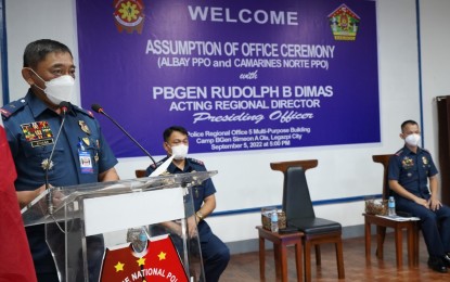 <p><strong>NEW POLICE HEADS</strong>. Brig. Gen. Rudolph Dimas, (left) Police Regional Office-5 regional director, gives his message and marching orders to two high-ranking officials who assumed post on Monday (Sept. 5, 2022). Col. Fernando Cunanan Jr. is the new chief of the Albay Provincial Police Office, while Col. Antonio Bilon Jr. now heads the Camarines Norte Provincial Police Office.<em> (Photo courtesy of PRO5/PIO)</em></p>