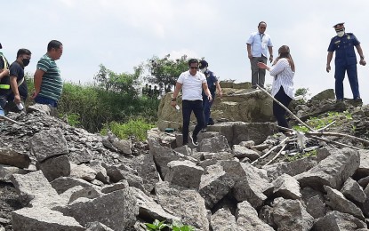 <p><strong>SURPRISE INSPECTION.</strong> Governor Daniel Fernando, together with Bulacan Environment and Natural Resources Office chief Julius Victor Degala and Maj. June Tabigo, chief of CIDG-Bulacan, conducts a surprise inspection at an illegal quarry site in Barangay Camangyanan, Santa Maria, Bulacan on Tuesday (Sept. 6, 2022). Five persons were arrested at the site will be charged with violations of environmental laws. <em>(Photo courtesy of the provincial government of Bulacan)</em></p>