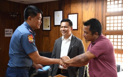 <p><strong>COURTESY CALL</strong>. Negros Oriental OIC provincial police director, Col. Jonathan Pineda, pays a courtesy call on Governor Pryde Henry Teves at the Capitol in Bacolod City on Tuesday (Sept. 6, 2022), as Provincial Legal Officer Ronel Depalubos looks on. The governor wants to find a property where law enforcement units can be co-located as a "one-stop shop". <em>(Photo courtesy of Capitol PIO)</em></p>