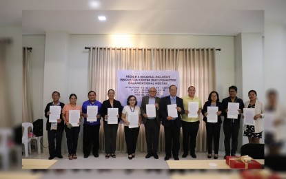 <p><strong>INNOVATION HUB</strong>. Key officials show signed copies of the memorandum of understanding for the creation of the Regional Inclusive Innovation Center in Eastern Visayas. The Department of Trade and Industry said on Friday (Sept. 9, 2022) that the center seeks to generate products, processes or service innovations deemed important to the goal of inclusive growth and development of the region.<em> (DTI photo)</em></p>