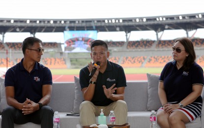 <p><strong>TRIATHLON HUB</strong>. RLC Residences New Clark City Triathlon race director Jumbo Tayag (center) announces the holding of the event in a press conference at the New Clark City Sports Complex in Capas, Tarlac on Monday (Sept. 12, 2022). He said around 700 triathletes are expected to run in the Sept. 25 event with some of them flying from other countries to join.<em> (PNA photo by Joey Razon)</em></p>