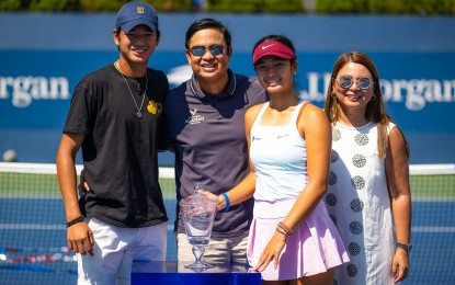 <p><strong>TENNIS CHAMP</strong>. Alex Eala with parents, Mike and Rizza, and brother Miko after her US Open girls’ singles triumph on Sept. 11, 2022 at the USTA Billie Jean King National Tennis Center in New York City. The tennis ace made history as the first Filipino to win a junior Grand Slam singles title. <em>(Photo courtesy of Alex Eala Facebook page)</em></p>