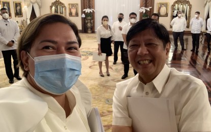 <p><strong>STILL POPULAR.</strong> Vice President Sara Duterte takes a selfie with President Ferdinand R. Marcos Jr. in a Malacañang Palace event in this undated photo. Marcos and Duterte still enjoy high approval and trust ratings, according to the March 2023 survey conducted by Pulse Asia. <em>(File photo)</em></p>