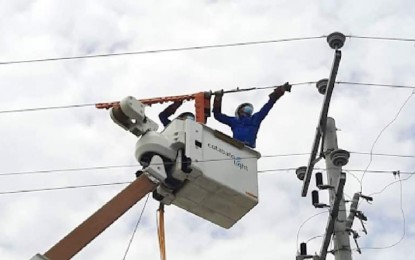 <p><strong>ENERGIZING COMMUNITIES.</strong> Linemen of Cotabato Light and Power Company (Cotabato Light) install additional power lines in this photo as the Aboitiz firm eyes completion of its Sitio Electrification Program by the end of 2022 in its franchise area. The power firm said they have so far energized 72 of 81 sitios in its area covering Cotabato City and parts of Datu Odin Sinsuat and Sultan Kudarat towns in Maguindanao. <em>(Photo courtesy of Cotabato Light)</em></p>