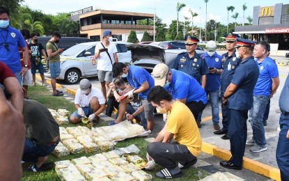 <p><strong>BIG FISH.</strong> Authorities seize more than PHP400 million worth of shabu from two drug suspects in a buy-bust operation along North Luzon Expressway in Mexico, Pampanga on Wednesday (Sept. 14, 2022). The two are Chinese nationals identified as Wenjie Chen, alias Harry, a resident of Barangay San Antonio, Gerona, Tarlac and Sy Yan Qing, of Barangay Sto. Domingo, Angeles City. <em>(Photo courtesy of Police Regional Office 3)</em></p>