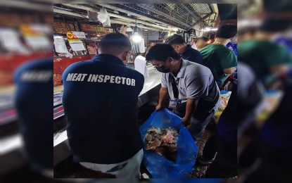 <p><strong>HOT MEAT.</strong> Meat inspectors from the Tarlac City Veterinary Office, in partnership with the Public Order and Safety Office and City Meat Inspection Office, confiscate "hot meat" weighing a total of 271.93 kilos at the Uptown Market on Tuesday (Sept. 13, 2022). The operation was part of the city government's intensified crackdown against the proliferation of “double dead” meat products that did not pass the government’s inspection standards. <em>(Photo courtesy of the City Government of Tarlac)</em></p>