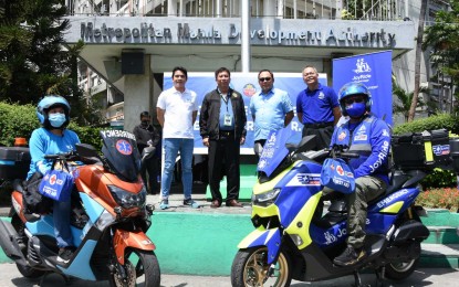 <p><strong>TRAINED RESPONDERS.</strong> MMDA, Angkas, and JoyRide PH officials pose for a photo at the MMDA office in Makati City on Friday (Sept. 16, 2022). The agency and the two ride-hailing services inked a memorandum of understanding for the dispatch of trained motorcycle emergency responders. <em>(Photo courtesy of MMDA)</em></p>