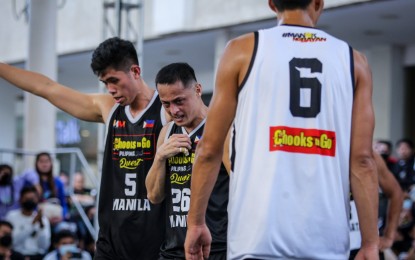 <p><strong>'THANK YOU, LORD!'</strong> Chico Lanete makes the sign of the cross after scoring the game-winning free throw for the Manila Chooks against world number seven Ulaanbaatar MMC Energy in the Chooks-to-Go Pilipinas 3x3 International Quest at the Ayala Malls Solenad Activity Center in Sta. Rosa City on Sept. 16, 2022. Manila is now 2-0 in Pool A with its showdown against Zavkhan to finish its pool stage assignments ongoing as of posting. <em>(Photo courtesy of Chooks-to-Go)</em></p>