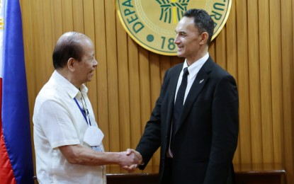 <p><strong>AGRI PARTNERSHIP</strong>. Agriculture Senior Undersecretary Domingo Panganiban (left) shakes hands with New Zealand Ambassador to the Philippines Peter Kell as they discussed more agricultural partnerships on Friday (Sept. 16, 2022). Both parties expressed willingness to intensify their coordination on agricultural trade and plan to combat the effects of climate change. <em>(Photo Courtesy: DA)</em></p>