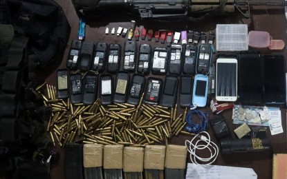 <p><strong>EVIDENCE.</strong> Authorities display the items recovered from slain New People’s Army leader Noel Alacre in Tandag City, Surigao del Sur on Friday (Sept. 16, 2022). He was said to be a  part of a group that committed arson the day before. <em>(Courtesy of Philippine Army-4ID)</em></p>