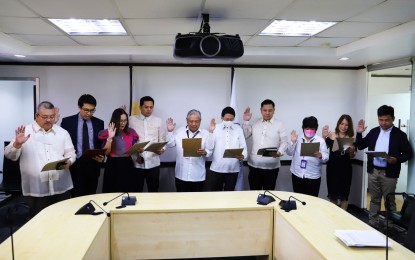 <p><strong>NEW OFFICIALS.</strong> (From left) Newly-appointed LTO Executive Director Horatio Enrico Bona, DOTr Assistant Secretary Leonel Cray De Velez, Assistant Secretary Maria Paula Bautista Domingo, Undersecretary Mark Steven Pastor, DOTr Secretary Jaime Bautista, Assistant Secretary Jesus Nathaniel Martin Bermejo Gonzales, Director III Ma. Marisa Malabag, Director III Zenaida Biteng, and Director III Joel Laguerta during their oath of office on Friday (Sept. 16, 2022).<em> (Photo courtesy of DOTr)</em></p>