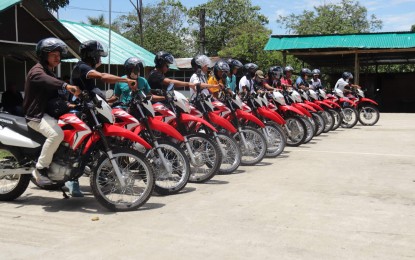 <p><strong>SUPPORTING PEACE.</strong> The Davao City's Peace 911 provides Paquibato District Peace Builders with 15 motorcycles to strengthen their patrol operations in the area. The peace builders are composed of former communist rebels who have surrendered to the government.<em> (Photo courtesy of 10ID)</em></p>