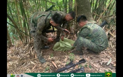 <p><strong>UNEARTHED.</strong> Military troops recover firearms and ammunition belonging to the Communist Party of the Philippines-New People's Army in Sitio Sarumbibit, Barangay San Mateo, Norzagaray, Bulacan on Sept. 17, 2022. The recovered war materiel includes rifles of various caliber, ammunition, and different types of magazines. <em>(Photo courtesy of the Army's 7th Infantry Division)</em></p>