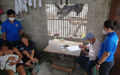 <p><strong>CAUGHT IN THE ACT</strong>. Authorities arrest Edelyn Pendon and Ana M. Agustin (seated, left, and second from left) during an entrapment operation by the Criminal Investigation and Detection Group (CIDG) and the Iloilo City Social Welfare and Development Office on Tuesday (Sept. 20, 2022). The two will be facing charges for violation of Republic Act  (RA) 9208 or Trafficking in Persons Act of 2003 and RA 7610 or the Child Abuse Law.<em> (PNA photo courtesy of CIDG)</em></p>