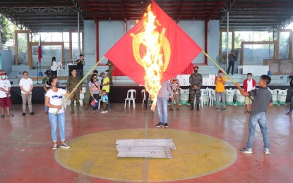 <p><strong>MASS SURRENDER</strong>. Some 16 members of the Communist Party of the Philippines-New People's Army surrender to civil and military authorities in Negros Oriental on Tuesday (Sept. 20, 2022). They burned the flag of the rebel group during their formal turnover to the Task Force to End Local Communist Armed Conflict in Guihulngan City. <em>(Photo courtesy of the 62IB)</em></p>